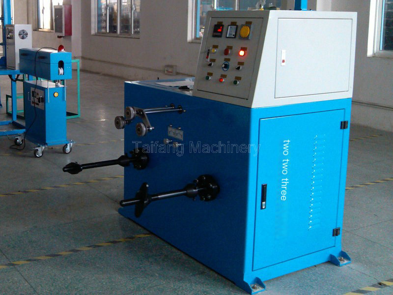 Double axis take-up machine